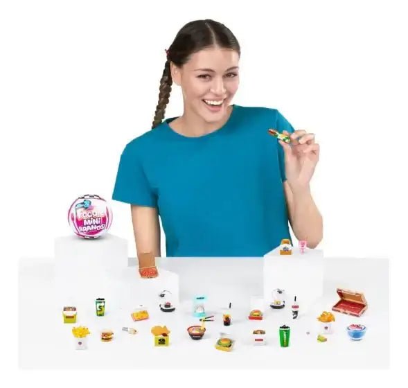 A photo of a girl playing with mini brands